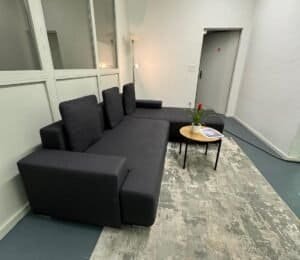 Comfortable black corner sofa with bed function – buy Occasion sofa at SofaLab