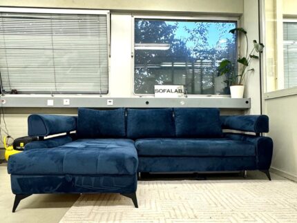 Neuwertiges Ecksofa in marineblauem Samt mit Bettfunktion