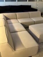 Modular sofa sand beige with footrest – Occasion sofa for sale at SofaLab