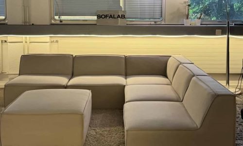 Modular sofa sand beige with footrest – Occasion sofa for sale at SofaLab