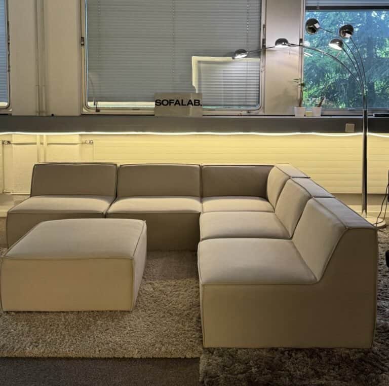 Modular sofa sand beige with footrest – Occasion sofa for sale at SofaLab
