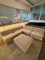 Modular sofa sand beige with footrest – Occasion sofa for sale at SofaLab