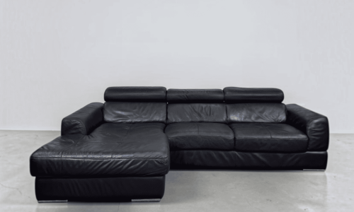 Corner Sofa made of black real leather with adjustable pillows – buy Occasion sofa at SofaLab
