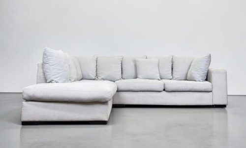 Corner Sofa made of light gray fabric, including all pillows – buy Occasion sofa at SofaLab